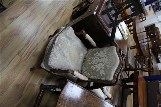 A pair of Louis XV provincial French beech framed fauteuils,